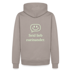 Design Hoodie „Seid lieb zueinander“ für Herren aus Bio-Baumwolle, Farbe: beige – Dankfabrik.