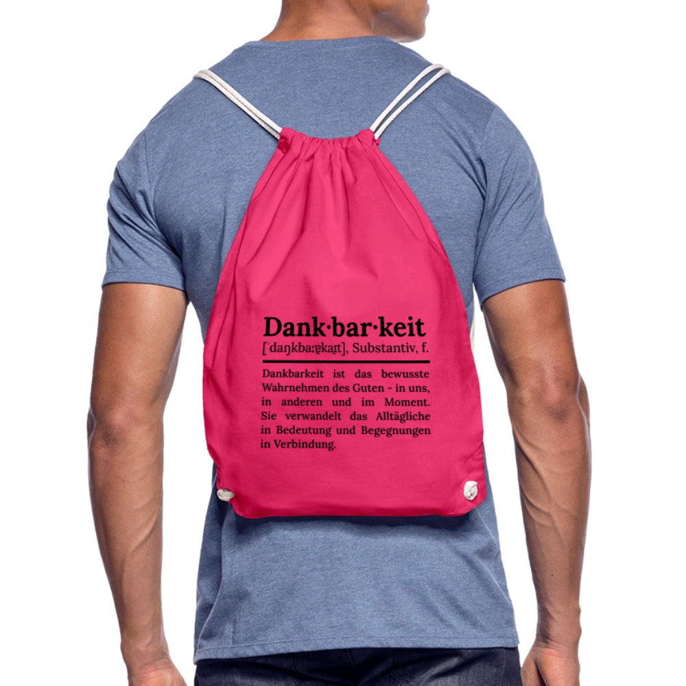 Getragener Design-Turnbeutel „Dankbarkeit“ in rosa aus Bio-Baumwolle. Nachhaltiger Stoffbeutel als treuer Alltagsbegleiter.