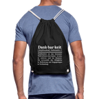 Getragener Design-Turnbeutel „Dankbarkeit“ in schwarz aus Bio-Baumwolle. Nachhaltiger Stoffbeutel als treuer Alltagsbegleiter.
